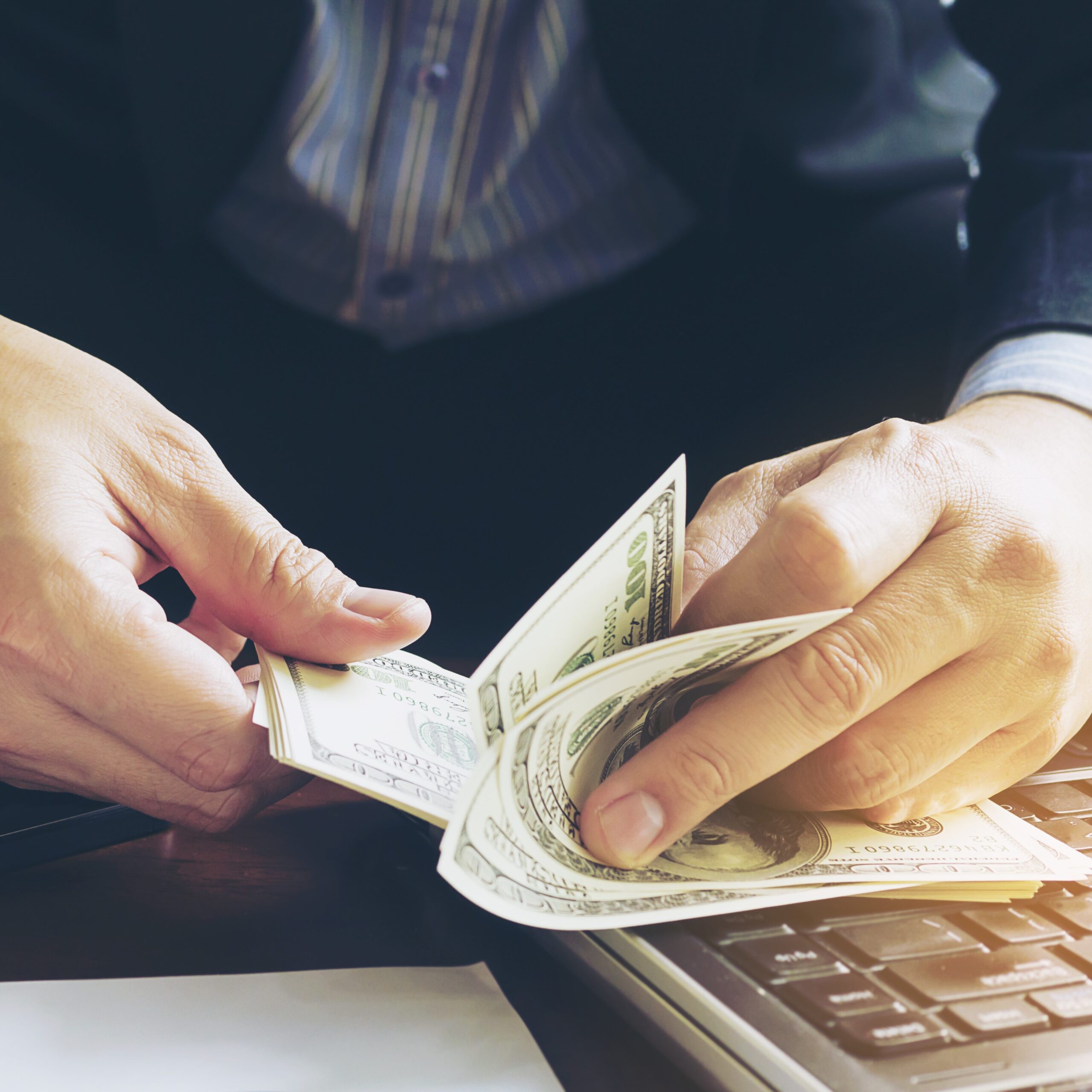 business man counting dollar banknote online business concept